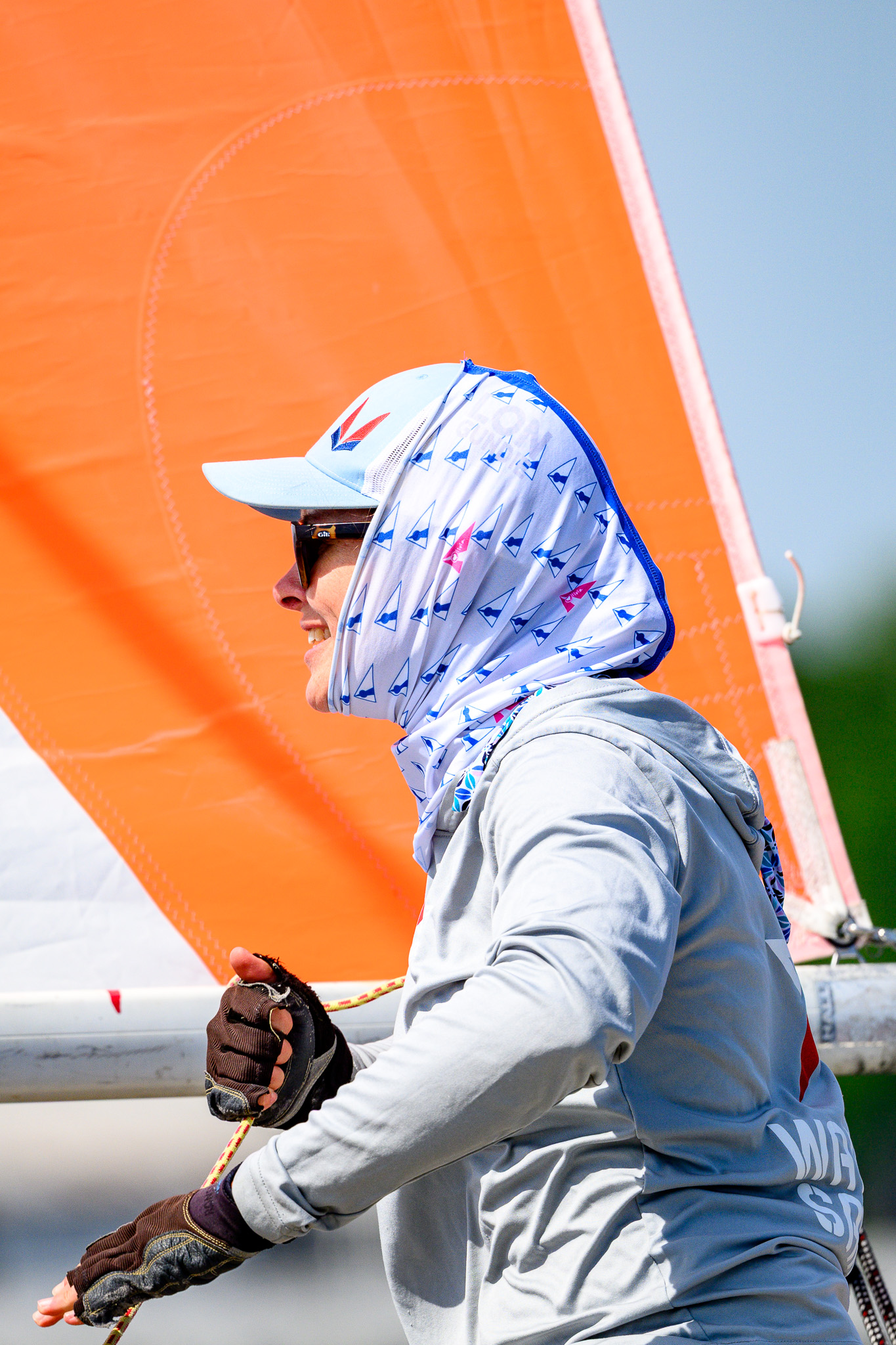 Crew member trimming during a race